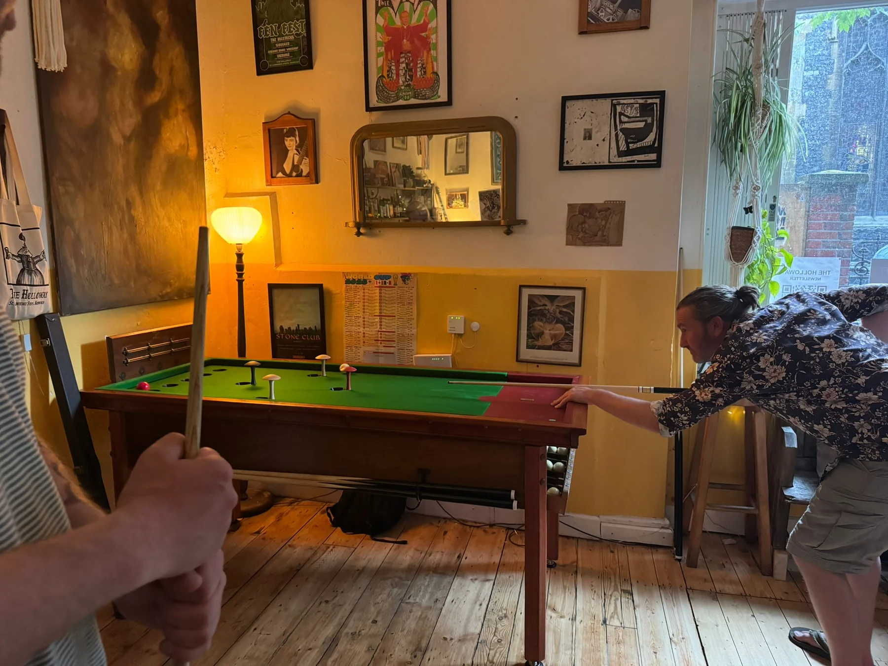 Players using the bar billiards table during The Holloway launch